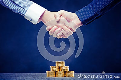 Shaking hands with save money Stock Photo