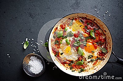 Shakshouka Eggs poached eggs in a spicy tomato sauce Stock Photo