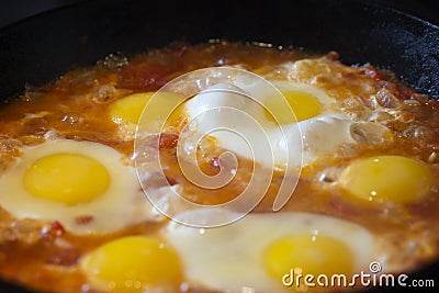 Shakshouka - fried eggs with tomatoes, Israeli national dish. Stock Photo