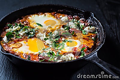 Shakshouka - Middle eastern traditional dish with poached eggs in tomato sauce Stock Photo