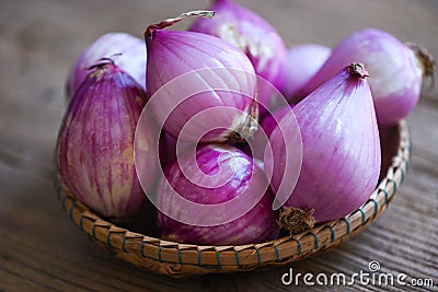 Shallots or red onion, purple shallots on basket , fresh shallot for medicinal products or herbs and spices Thai food made from Stock Photo