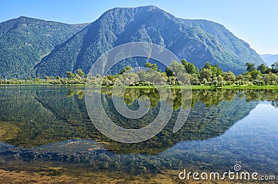 Shallow bay on South part of Lake Teletskoye in Altay Stock Photo