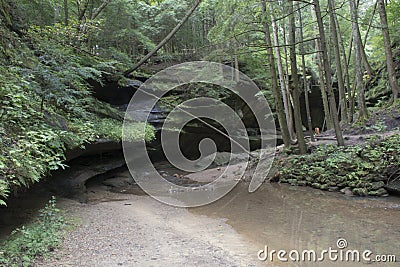 Shallow cave with stream Stock Photo