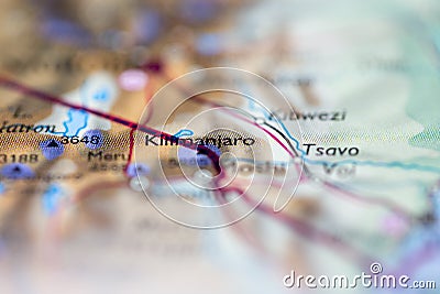 Shallow depth of field focus on geographical map location of Mount Kilimanjaro in Tanzania Africa continent on atlas Stock Photo
