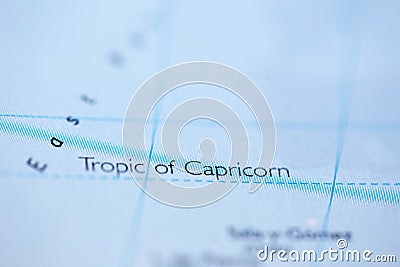 Shallow depth of field focus on geographical map location of Tropic of Capricorn line on atlas Stock Photo