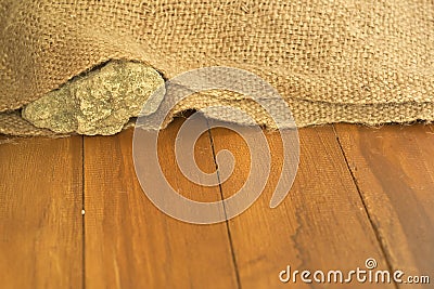 Shallow DOF of rock inside old sack Stock Photo