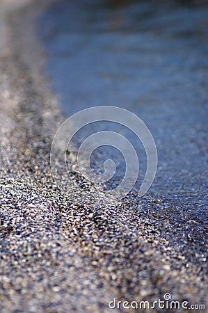 Shallow DOF on sand and sea Stock Photo