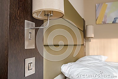 Slept bedding and pillow seen in a modern bedroom apartment. Editorial Stock Photo