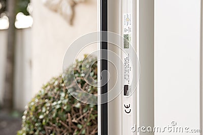 Shallow focus of CE marking and other conformances on newly installed uPVC double glazed door Editorial Stock Photo