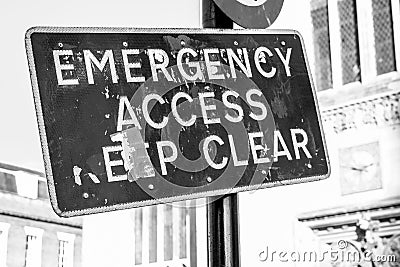 Damaged emergency access sign seen in a city centre. Editorial Stock Photo