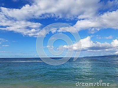 Shallow wavy ocean waters of Polo Beach on the north shore Stock Photo