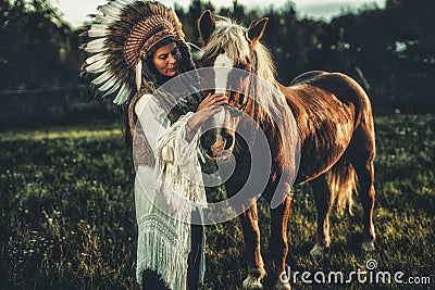 Shaman woman in landscape with her horse. Stock Photo