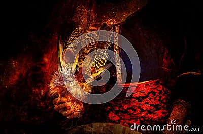 Shamanic feathers on denim on abstract structured space background. Stock Photo
