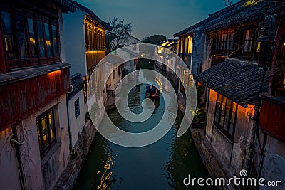SHANGHAI, CHINA: Beautiful evening light creates magic mood inside Zhouzhuang water town, ancient city district with Editorial Stock Photo