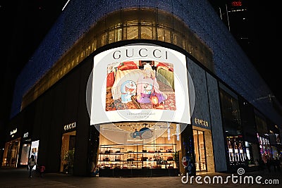 Facade of GUCCI flagship store at night Editorial Stock Photo