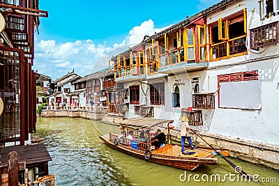 Shanghai, China - May, 2019: China traditional tourist boat on canal of Shanghai Zhujiajiao Old Town in Shanghai, China during Editorial Stock Photo