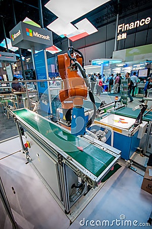 SHANGHAI, CHINA - SEPTEMBER 2, 2016: Industrial KUKA robot at Huawei Connect 2016 information technology conference and Editorial Stock Photo