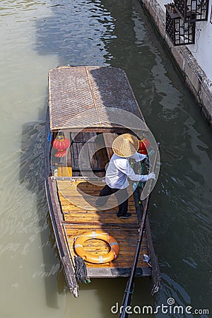 Chinese traditional rowboat sightseeing tour in Zhujiajiao Ancient Water Town, famous tourist destination in Shanghai, China Editorial Stock Photo