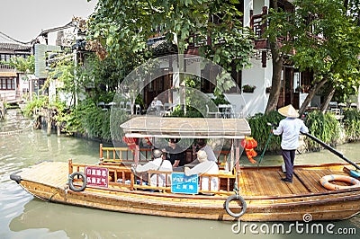 Chinese traditional rowboat sightseeing tour in Zhujiajiao Ancient Water Town, famous tourist destination in Shanghai, China Editorial Stock Photo