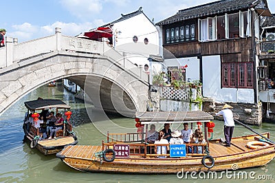 Tourist wooden rowboat in Zhujiajiao Ancient Water Town, a historic village located in the Qingpu District of Shanghai, China Editorial Stock Photo