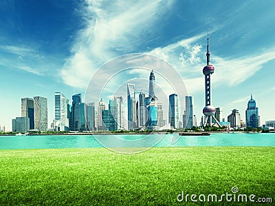Shanghai skyline and green grass in park Stock Photo