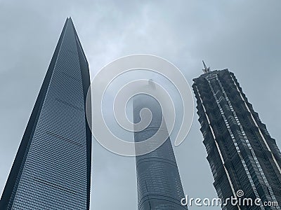 Shanghai--Skyscrapers and Shanghai Tower lost in clouds Editorial Stock Photo