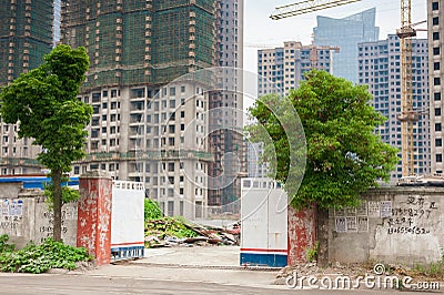 Entrance to the constuction site with two trees Editorial Stock Photo