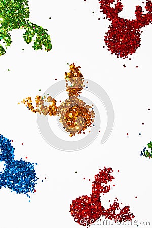 The shape of a reindeer's head of shiny colorful tinsels on white background. Christmas idea Stock Photo