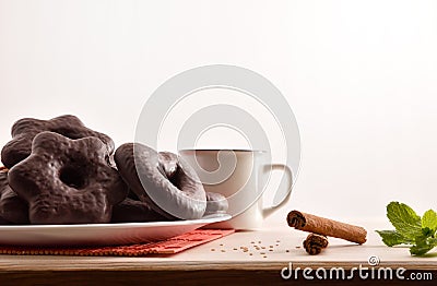 Shaped chocolate cookies with mint and cinnamon on table isolated background Stock Photo