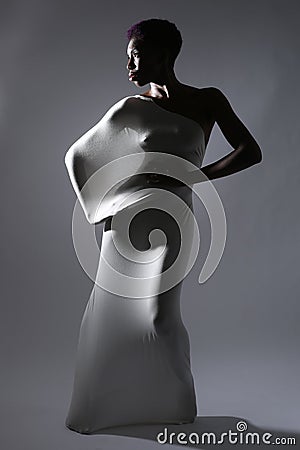 Shapely Woman in Creative Light and Spandex Fabric Stock Photo