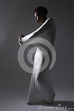 Shapely Woman in Creative Light and Spandex Fabric Stock Photo