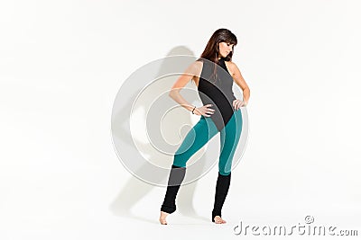 Shapely young woman wearing an 80s dance outfit Stock Photo