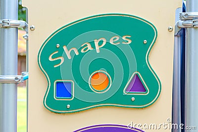 A shapes sign located on a playground for kids Stock Photo