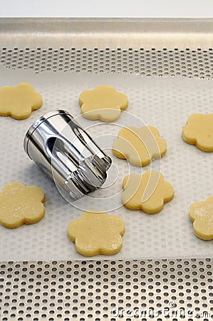 Shaping shortbread cookies with a biscuit cutter Stock Photo