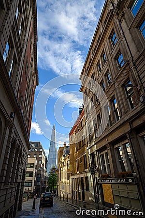 The Shard as seen from St Mary at Hill in the City of London, UK Editorial Stock Photo