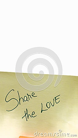 Share the love handwriting text close up isolated on yellow paper with copy space Stock Photo