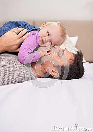 They share such a special bond. A baby girl lying down on her fatheramp039s chest. Stock Photo