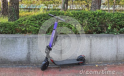 Shared electric scooters standing on the sidewalk is Seoul, Korea Editorial Stock Photo
