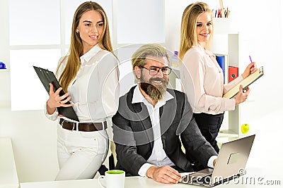 Sharing good news with friend. male boss with his secretary. office people discuss business. modern office life Stock Photo