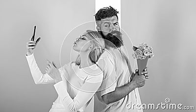 Sharing happy selfie. Woman capturing happy moment boyfriend bring bouquet flowers. Couple in love bouquet dating Stock Photo