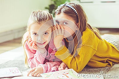 Sharing secrets with my sister Stock Photo