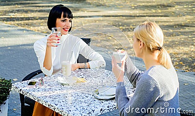Sharing thoughts. Female friendship. Trustful communication. Girls friends drink coffee and talk. True friendship Stock Photo