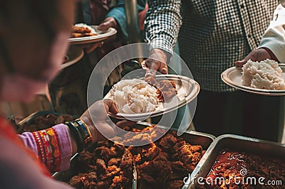 Sharing warm food for homeless and homeless people Stock Photo