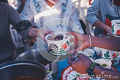 Sharing warm food for homeless and homeless people Stock Photo