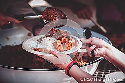 Sharing warm food for homeless and homeless people Stock Photo