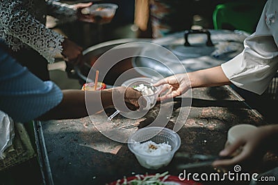 Sharing warm food for homeless and homeless people Stock Photo