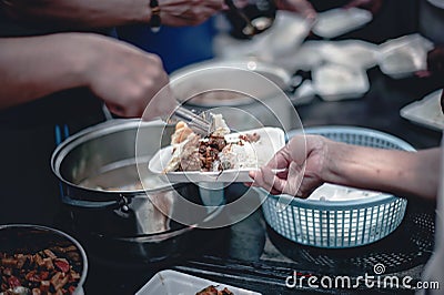 Sharing warm food for homeless and homeless people Stock Photo