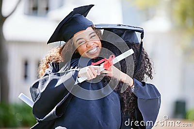 Sharing warm memories of the past and dreams of the future. Portrait of a young woman hugging her friend on graduation Stock Photo