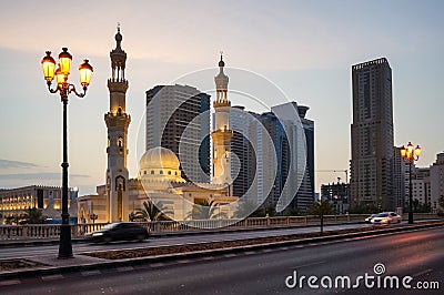 Sharjah. Summer 2016. Evening Al Qasba Mosque in the urban streetscape. Editorial Stock Photo