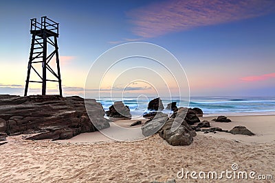Shark Watch Tower and jagged rocks Australia Stock Photo